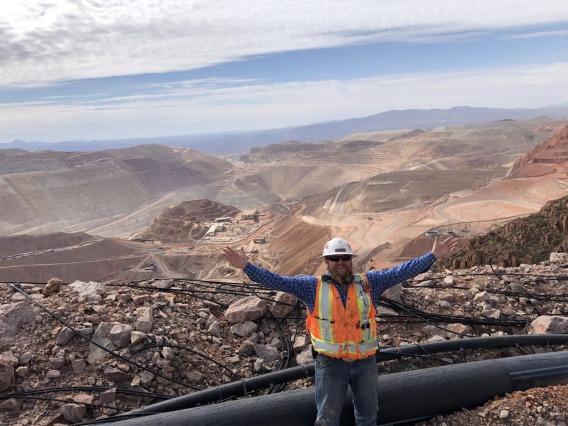 Engineer in front of open pit mine