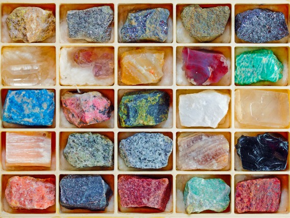 Colorful mineral samples in a box